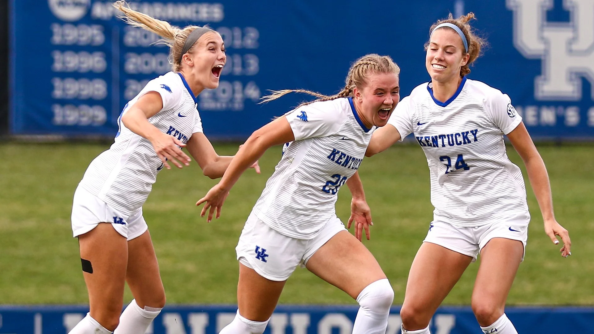 Kentucky soccer players celebrating together